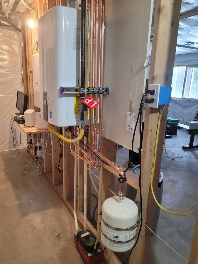 Licensed plumber repairing a kitchen sink in Rye